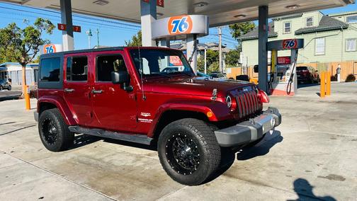Red 2009 Jeep Wrangler Unlimited Sahara