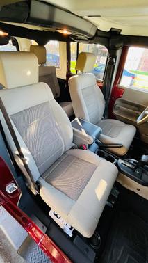 Red 2009 Jeep Wrangler Unlimited Sahara