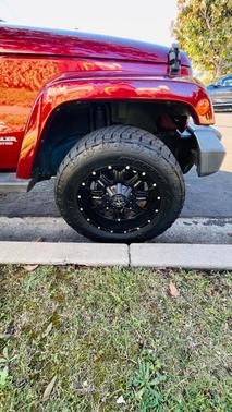 Red 2009 Jeep Wrangler Unlimited Sahara