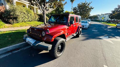Red 2009 Jeep Wrangler Unlimited Sahara