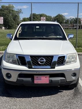 White 2015 Nissan Frontier SL