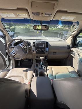 White 2015 Nissan Frontier SL