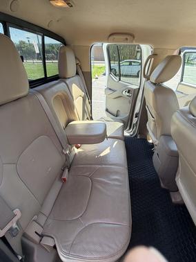 White 2015 Nissan Frontier SL