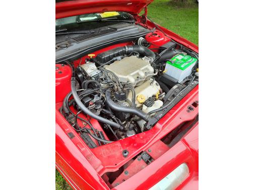 Red 1995 Chrysler LeBaron GTC