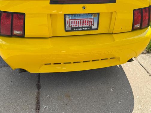 Yellow 2001 Ford Mustang GT