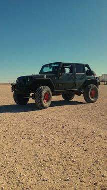 Green 2015 Jeep Wrangler Unlimited Willys Wheeler