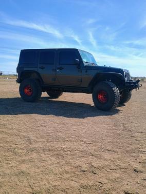 Green 2015 Jeep Wrangler Unlimited Willys Wheeler
