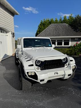 White 2014 Jeep Wrangler Unlimited Sahara