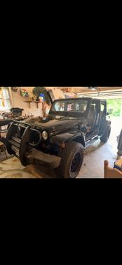 Black 2011 Jeep Wrangler Unlimited Sahara