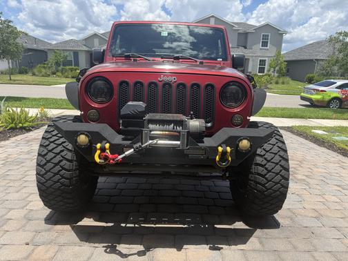 Red 2012 Jeep Wrangler Unlimited Sahara
