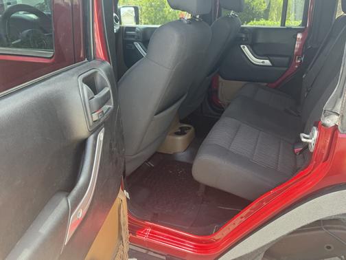 Red 2012 Jeep Wrangler Unlimited Sahara