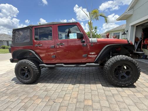 Red 2012 Jeep Wrangler Unlimited Sahara