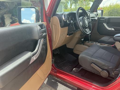 Red 2012 Jeep Wrangler Unlimited Sahara