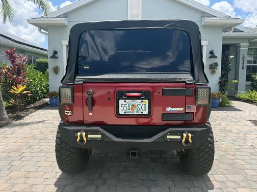 Red 2012 Jeep Wrangler Unlimited Sahara