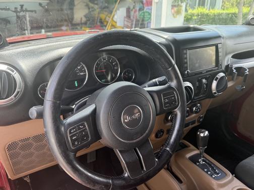 Red 2012 Jeep Wrangler Unlimited Sahara