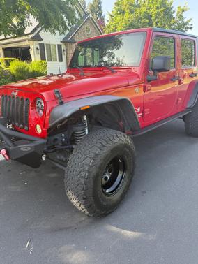 Red 2009 Jeep Wrangler Unlimited X