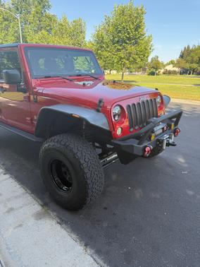 Red 2009 Jeep Wrangler Unlimited X