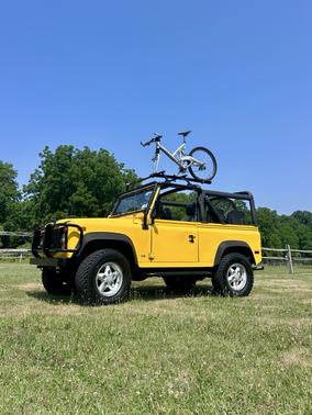 Yellow 1995 Land Rover Defender 90