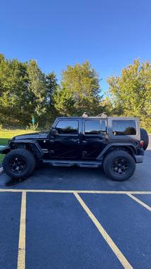 Black 2013 Jeep Wrangler Unlimited Sport