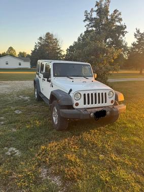 White 2010 Jeep Wrangler Unlimited Sport