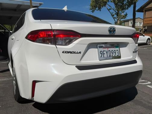 White 2023 Toyota Corolla Hybrid LE