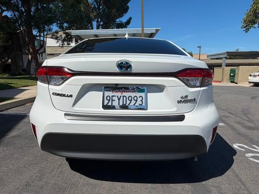 White 2023 Toyota Corolla Hybrid LE