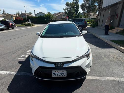 White 2023 Toyota Corolla Hybrid LE