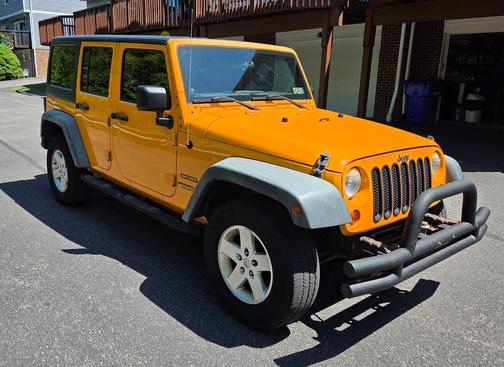 Yellow 2012 Jeep Wrangler Unlimited Sport