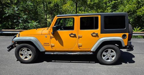 Yellow 2012 Jeep Wrangler Unlimited Sport