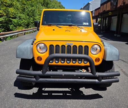 Yellow 2012 Jeep Wrangler Unlimited Sport