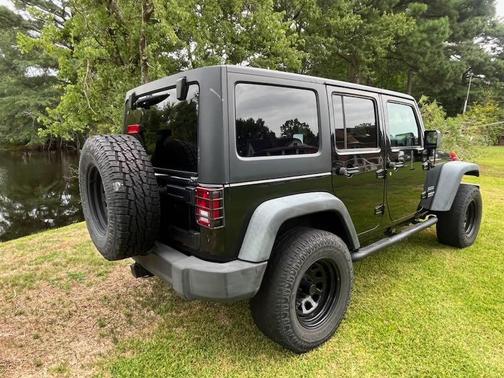 Black 2014 Jeep Wrangler Unlimited Sport