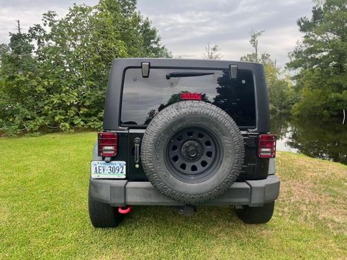 Black 2014 Jeep Wrangler Unlimited Sport
