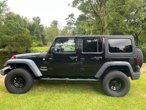 Black 2014 Jeep Wrangler Unlimited Sport