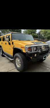 Yellow 2005 Hummer H2 Base