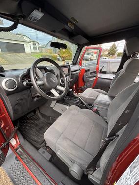 Orange 2009 Jeep Wrangler Unlimited Sahara
