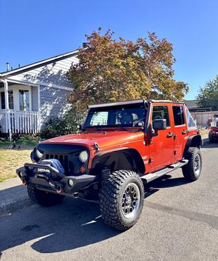 Orange 2009 Jeep Wrangler Unlimited Sahara
