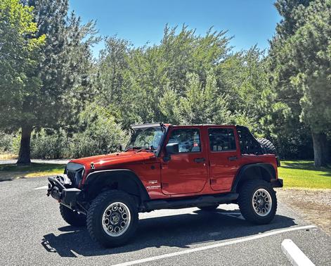 Orange 2009 Jeep Wrangler Unlimited Sahara