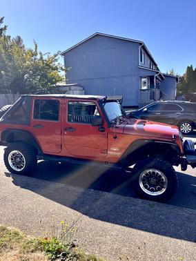 Orange 2009 Jeep Wrangler Unlimited Sahara