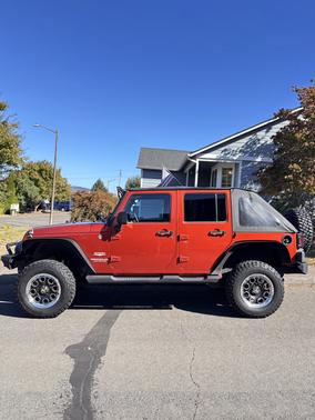Orange 2009 Jeep Wrangler Unlimited Sahara