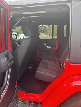 Red 2015 Jeep Wrangler Unlimited Sahara