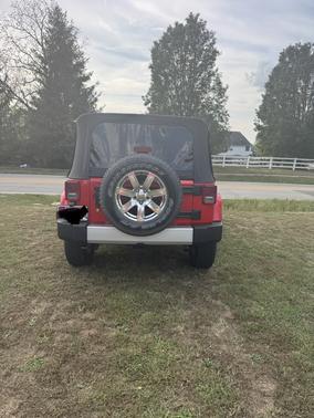 Red 2015 Jeep Wrangler Unlimited Sahara
