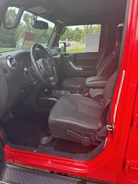 Red 2015 Jeep Wrangler Unlimited Sahara