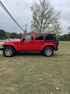 Red 2015 Jeep Wrangler Unlimited Sahara