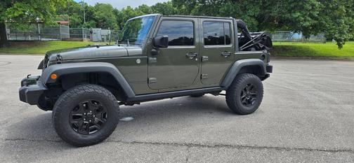 Green 2015 Jeep Wrangler Unlimited Willys Wheeler