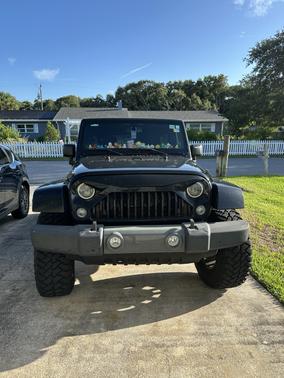 Black 2014 Jeep Wrangler Unlimited Sahara