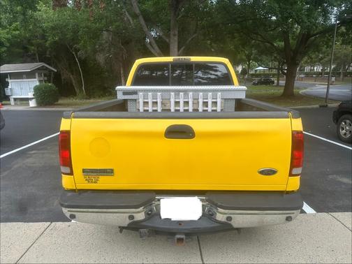 Yellow 2006 Ford F-250 Lariat Crew Cab Super Duty