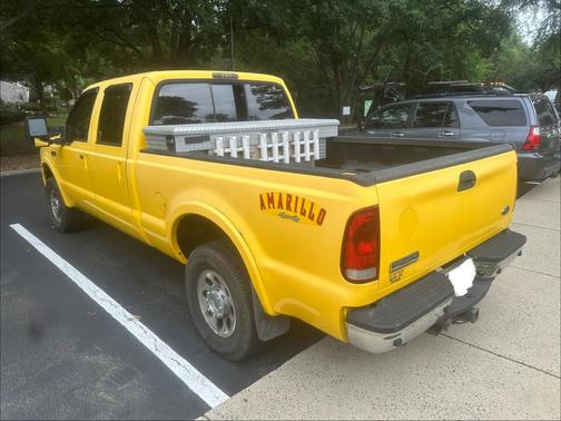 Yellow 2006 Ford F-250 Lariat Crew Cab Super Duty