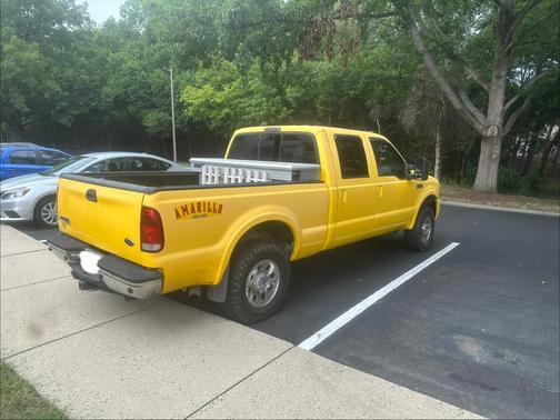 Yellow 2006 Ford F-250 Lariat Crew Cab Super Duty