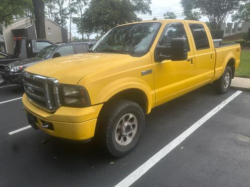 Yellow 2006 Ford F-250 Lariat Crew Cab Super Duty