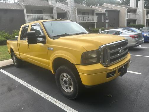 Yellow 2006 Ford F-250 Lariat Crew Cab Super Duty